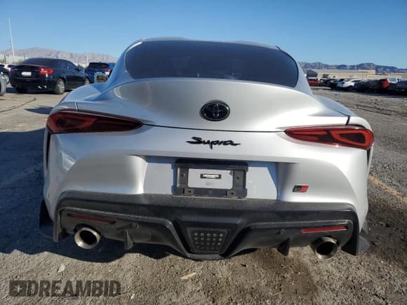 ✅ 2022 Toyota Supra Premium • VIN: WZ1DB0C09NW052837 • Лот: 86658065. Опубликован ранее на Copart с пробегом 27 193 миль. Бесплатный доступ к архиву аукционных продаж из США и подробный отчёт об истории автомобиля на DreamBid. Изображение 6.