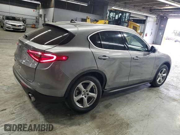 ✅ 2018 Alfa Romeo Stelvio • VIN: ZASFAKAN7J7C01195 • Lot: 82287485. Listed on Copart with 62,431 mi. Free auction sales archive from the USA and detailed vehicle history report at DreamBid. Image 3.