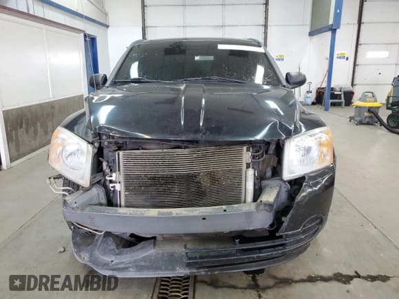 ✅ 2010 Dodge Caliber SXT • VIN: 1B3CB4HA5AD552617 • Лот: 82709404. Опубликован ранее на Copart с пробегом 136 349 миль. Бесплатный доступ к архиву аукционных продаж из США и подробный отчёт об истории автомобиля на DreamBid. Изображение 5.