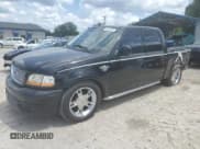 ✅ 2003 Ford F-150 Harley-Davidson • VIN: 1FTRW07393KC28559 • Lot: 55201835. Listed on Copart with 139,288 mi. Free auction sales archive from the USA and detailed vehicle history report at DreamBid. Image 1.