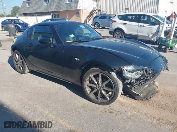 ✅ 2021 Mazda MX-5 Miata Grand Touring • VIN: JM1NDAM79M0459850 • Lot: 43117283. Wystawiony na IAAI z przebiegiem 17 265 mil. Bezpłatny archiwum sprzedaży aukcyjnych z USA i szczegółowy raport historii pojazdu na DreamBid. Zdjęcie 1.