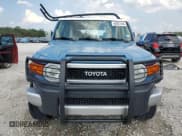 ✅ 2011 Toyota FJ Cruiser • VIN: JTEBU4BF9BK103961 • Lot: 66007444. Wystawiony na Copart z przebiegiem 195 168 mil. Bezpłatny archiwum sprzedaży aukcyjnych z USA i szczegółowy raport historii pojazdu na DreamBid. Zdjęcie 5.