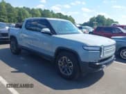 ✅ 2022 Rivian R1T Adventure • VIN: 7FCTGAAA6NN015709 • Lot: 43093648. Listed on IAAI with 22,004 mi. Free auction sales archive from the USA and detailed vehicle history report at DreamBid. Image 1.