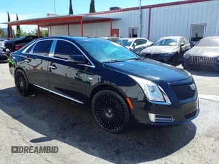 ✅ 2013 Cadillac XTS Platinum • VIN: 2G61V5S32D9227585 • Lot: 42630428. Wystawiony na IAAI z przebiegiem 124 661 mil. Bezpłatny archiwum sprzedaży aukcyjnych z USA i szczegółowy raport historii pojazdu na DreamBid. Zdjęcie 1.