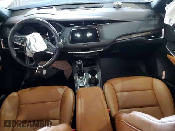 ✅ 2023 Cadillac XT4 AWD Sport • VIN: 1GYFZFR41PF103650 • Лот: 59321355. Опубликован ранее на Copart с пробегом 27 092 миль. Бесплатный доступ к архиву аукционных продаж из США и подробный отчёт об истории автомобиля на DreamBid. Изображение 8.