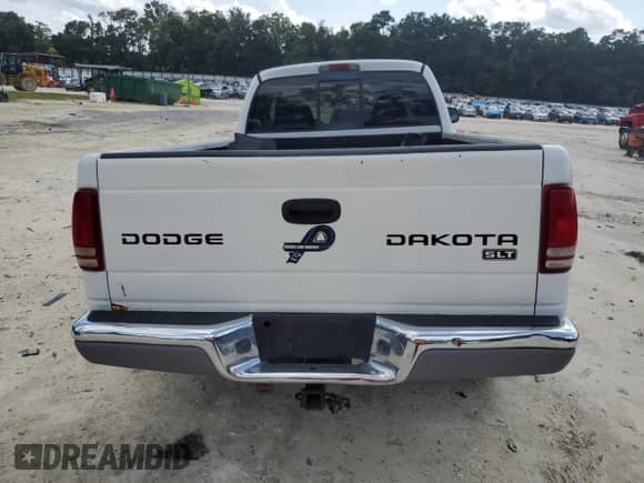 2003 Dodge Dakota SLT z VIN 1D7HL42XX3S333865, wystawiony jako Copart lot #73509404 z przebiegiem 123 515 mil mil oraz Szkoda całkowita • Salvage title. Historia ofert i sprzedaży dostępna na DreamBid. Obrazek 6.