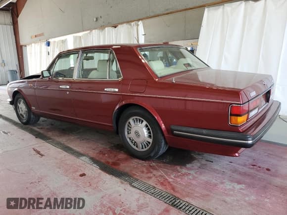 ✅ 1995 Bentley Arnage • VIN: SCBZR03CXSCX55518 • Лот: 64439924. Опубликован ранее на Copart с пробегом 11 362 миль. Бесплатный доступ к архиву аукционных продаж из США и подробный отчёт об истории автомобиля на DreamBid. Изображение 2.
