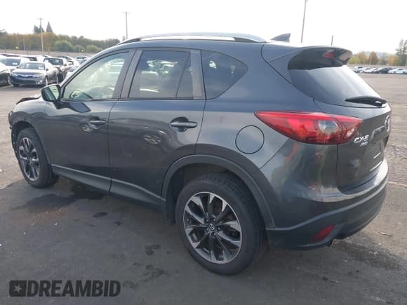 ✅ 2016 Mazda CX-5 Grand Touring • VIN: JM3KE4DY4G0880137 • Lot: 43516086. Wystawiony na IAAI z przebiegiem 135 661 mil. Bezpłatny archiwum sprzedaży aukcyjnych z USA i szczegółowy raport historii pojazdu na DreamBid. Zdjęcie 3.