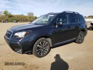 2017 Subaru Forester Touring z VIN JF2SJGWCXHH543032, wystawiony jako Copart lot #82477415 z przebiegiem 154 499 mil mil oraz Szkoda całkowita • Salvage title. Historia ofert i sprzedaży dostępna na DreamBid. Obrazek 1.
