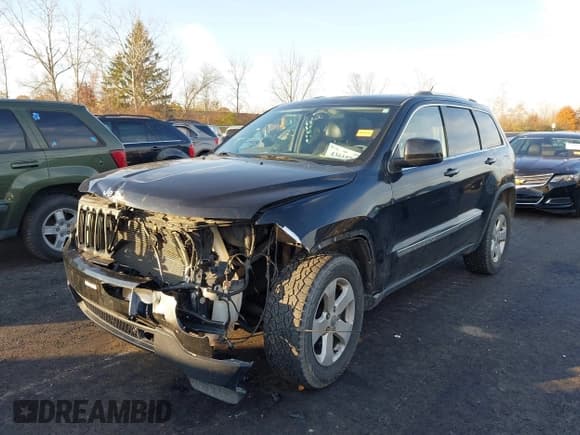 ✅ 2012 Jeep Grand Cherokee Laredo • VIN: 1C4RJFAG3CC221565 • Lot: 43618945. Listed on IAAI with 160,737 mi. Free auction sales archive from the USA and detailed vehicle history report at DreamBid. Image 2.