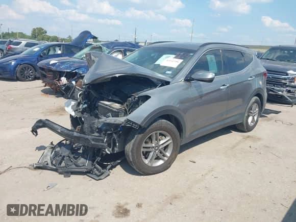 2018 Hyundai Santa Fe 2.4L z VIN 5NMZUDLB1JH065408, wystawiony jako IAAI lot #43342396 z przebiegiem 113 154 mil mil oraz . Historia ofert i sprzedaży dostępna na DreamBid. Obrazek 2.