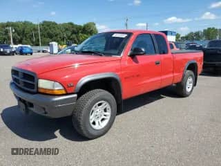 2002 Dodge Dakota z VIN 1B7GG12X02S543317, wystawiony jako Copart lot #68133955 z przebiegiem 128 938 mil mil oraz Szkoda całkowita • Salvage title. Historia ofert i sprzedaży dostępna na DreamBid. Obrazek 1.
