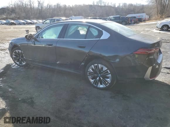✅ 2025 BMW i5 • VIN: WBY13HG0XSCS35733 • Lot: 43990715. Listed on Copart with 670 mi. Free auction sales archive from the USA and detailed vehicle history report at DreamBid. Image 2.
