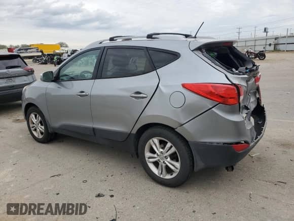 2013 Hyundai Tucson GLS z VIN KM8JU3AC6DU653140, wystawiony jako Copart lot #56669105 z przebiegiem 162 901 mil mil oraz Szkoda całkowita • Salvage title. Historia ofert i sprzedaży dostępna na DreamBid. Obrazek 2.