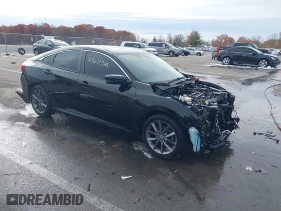 ✅ 2021 Honda Civic EX • VIN: 19XFC1F30ME000604 • Lot: 43612748. Listed on IAAI with 58,774 mi. Free auction sales archive from the USA and detailed vehicle history report at DreamBid. Image 1.