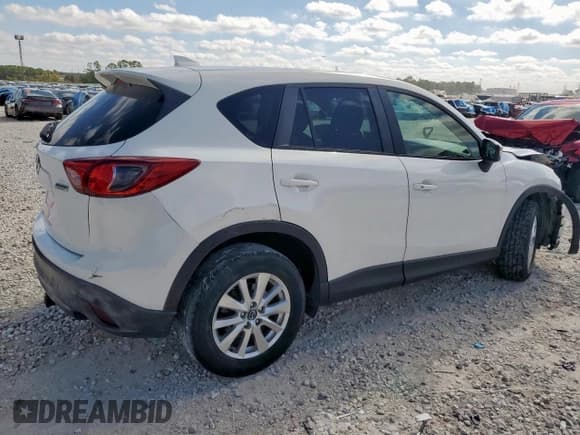 ✅ 2016 Mazda CX-5 Touring • VIN: JM3KE2CY2G0607428 • Лот: 91684385. Опубликован ранее на Copart с пробегом 130 111 миль. Бесплатный доступ к архиву аукционных продаж из США и подробный отчёт об истории автомобиля на DreamBid. Изображение 3.