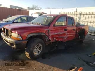 2002 Dodge Dakota Sport z VIN 1B7HG38NX2S515384, wystawiony jako Copart lot #80640954 z przebiegiem 247 495 mil mil oraz Szkoda całkowita • Salvage title. Historia ofert i sprzedaży dostępna na DreamBid. Obrazek 1.