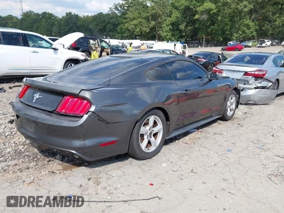 ✅ 2015 Ford Mustang V6 • VIN: 1FA6P8AM8F5395603 • Lot: 43297736. Listed on IAAI with 127,921 mi. Free auction sales archive from the USA and detailed vehicle history report at DreamBid. Image 4.