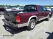2003 Dodge Dakota SLT z VIN 1D7HL48X13S201942, wystawiony jako Copart lot #57829145 z przebiegiem 212 912 mil mil oraz Szkoda całkowita • Salvage title. Historia ofert i sprzedaży dostępna na DreamBid. Obrazek 3.