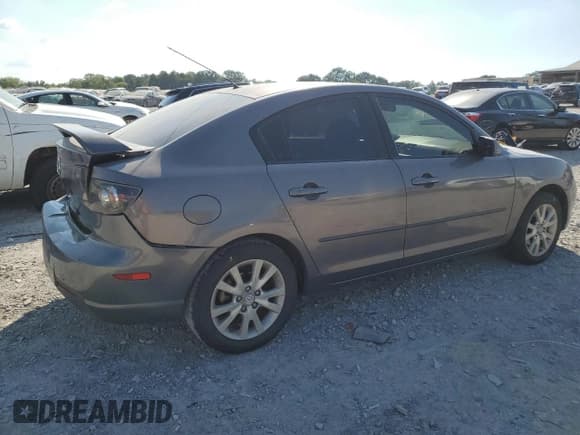 ✅ 2007 Mazda 3 i Touring • VIN: JM1BK32F471718077 • Лот: 69277595. Опубликован ранее на Copart с пробегом 256 154 миль. Бесплатный доступ к архиву аукционных продаж из США и подробный отчёт об истории автомобиля на DreamBid. Изображение 3.