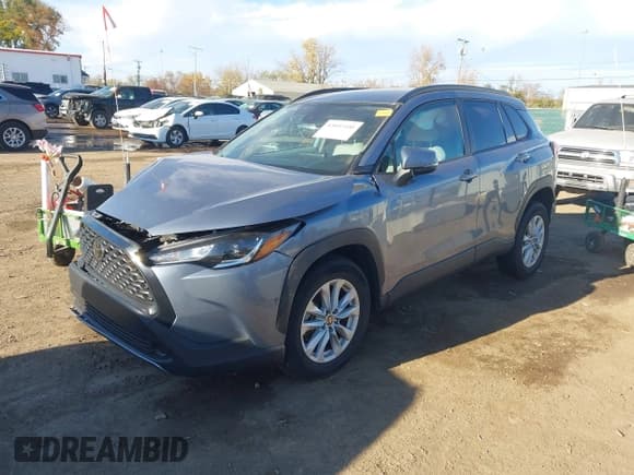 ✅ 2022 Toyota Corolla Cross LE • VIN: 7MUCAAAG5NV009458 • Lot: 43602100. Listed on IAAI with 33,797 mi. Free auction sales archive from the USA and detailed vehicle history report at DreamBid. Image 2.