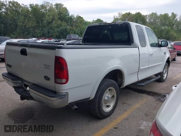 ✅ 1999 Ford F-150 • VIN: 1FTRX18W5XNB87105 • Lot: 43325057. Listed on IAAI with 159,328 mi. Free auction sales archive from the USA and detailed vehicle history report at DreamBid. Image 4.