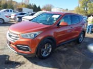 ✅ 2017 Hyundai Santa Fe 2.4L • VIN: 5XYZTDLB3HG452100 • Lot: 43706844. Wystawiony na IAAI z przebiegiem 149 566 mil. Bezpłatny archiwum sprzedaży aukcyjnych z USA i szczegółowy raport historii pojazdu na DreamBid. Zdjęcie 18.