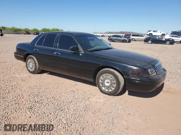 ✅ 2003 Ford Crown Victoria Standard • VIN: 2FAFP73W63X150334 • Lot: 62402895. Listed on Copart with 130,296 mi. Free auction sales archive from the USA and detailed vehicle history report at DreamBid. Image 4.