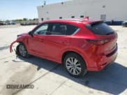 ✅ 2023 Mazda CX-5 Signature • VIN: JM3KFBXY7P0136013 • Lot: 56436355. Listed on Copart with 31,575 mi. Free auction sales archive from the USA and detailed vehicle history report at DreamBid. Image 2.