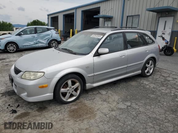 ✅ 2003 Mazda Protege • VIN: JM1BJ245131200147 • Lot: 62848564. Listed on Copart with 141,556 mi. Free auction sales archive from the USA and detailed vehicle history report at DreamBid. Image 1.