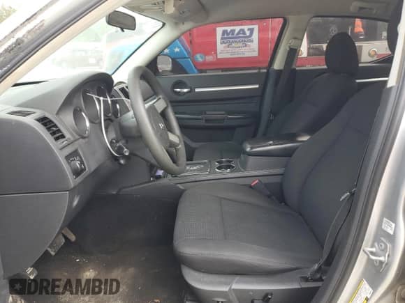 2009 Dodge Charger SXT с VIN 2B3KA33V69H504044, выставлен на аукционе Copart как лот 54199914 с пробегом 214 200 миль миль и Списание • Salvage title. История ставок и продаж доступна на DreamBid. Изображение 7.