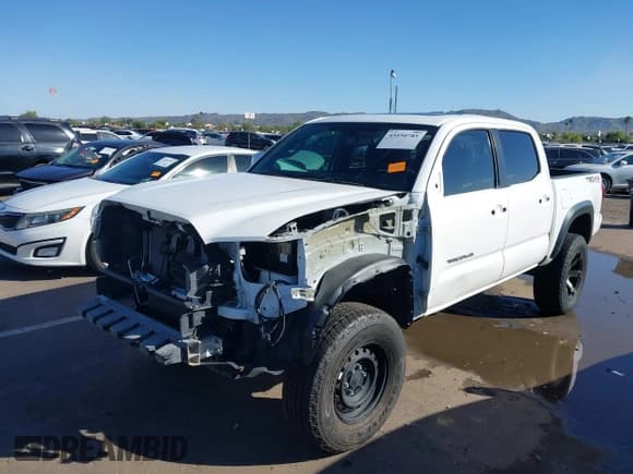 ✅ 2017 Toyota Tacoma SR5 • VIN: 3TMCZ5AN0HM103406 • Lot: 43450785. Listed on IAAI with 96,527 mi. Free auction sales archive from the USA and detailed vehicle history report at DreamBid. Image 6.