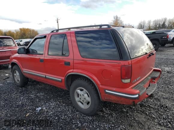 1999 Chevrolet Blazer LS z VIN 1GNDT13WXXK201988, wystawiony jako Copart lot #81960364 z przebiegiem 219 613 mil mil oraz Szkoda całkowita • Salvage title. Historia ofert i sprzedaży dostępna na DreamBid. Obrazek 2.