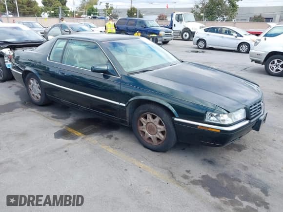 ✅ 1998 Cadillac Eldorado Touring • VIN: 1G6ET1299WU613236 • Lot: 43173727. Listed on IAAI with 165,556 mi. Free auction sales archive from the USA and detailed vehicle history report at DreamBid. Image 1.