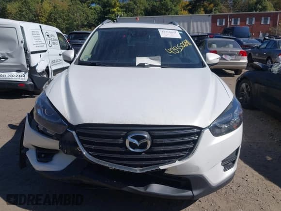 ✅ 2016 Mazda CX-5 Grand Touring • VIN: JM3KE4DY8G0908425 • Lot: 43350691. Wystawiony na IAAI z przebiegiem 144 684 mil. Bezpłatny archiwum sprzedaży aukcyjnych z USA i szczegółowy raport historii pojazdu na DreamBid. Zdjęcie 12.