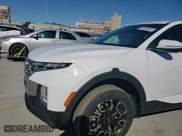 2022 Hyundai Santa Cruz SEL z VIN 5NTJBDAE3NH031402, wystawiony jako Copart lot #81236024 z przebiegiem 48 156 mil mil oraz Szkoda całkowita • Salvage title. Historia ofert i sprzedaży dostępna na DreamBid. Obrazek 11.