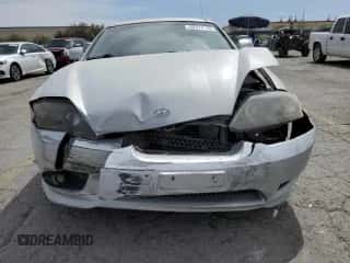 2006 Hyundai Tiburon GT с VIN KMHHN65F06U203701, выставлен на аукционе Copart как лот 52374135 с пробегом 90 796 миль миль и Списание • Salvage title. История ставок и продаж доступна на DreamBid. Изображение 5.