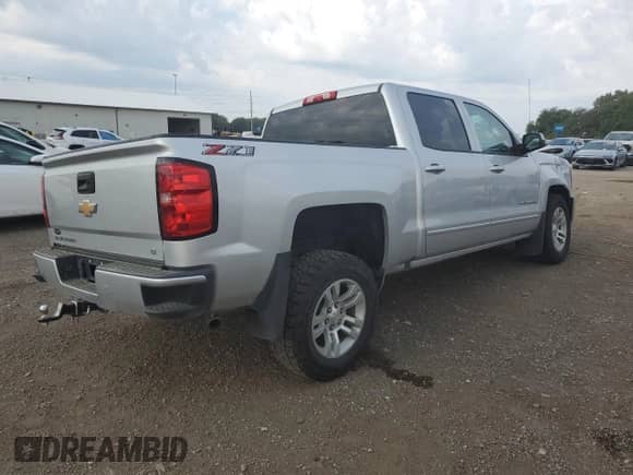 2018 Chevrolet Silverado 1500 LT с VIN 3GCUKREC2JG503173, выставлен на аукционе Copart как лот 80928005 с пробегом 107 558 миль миль и Списание • Salvage title. История ставок и продаж доступна на DreamBid. Изображение 3.