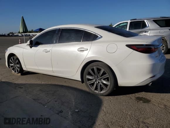 ✅ 2021 Mazda 6 Touring • VIN: JM1GL1VM0M1611282 • Лот: 85930235. Опубликован ранее на Copart с пробегом 124 447 миль. Бесплатный доступ к архиву аукционных продаж из США и подробный отчёт об истории автомобиля на DreamBid. Изображение 2.