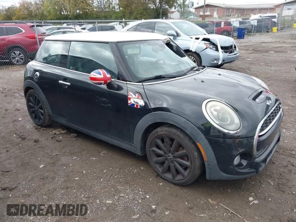 ✅ 2014 MINI Hardtop S • VIN: WMWXM7C51ET987469 • Lot: 43581447. Listed on IAAI with 142,143 mi. Free auction sales archive from the USA and detailed vehicle history report at DreamBid. Image 1.