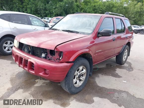 ✅ 2004 Isuzu Rodeo S • VIN: 4S2CK58Y444303591 • Lot: 42707772. Listed on IAAI with 156,792 mi. Free auction sales archive from the USA and detailed vehicle history report at DreamBid. Image 2.