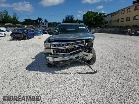 2014 Chevrolet Silverado 1500 LT z VIN 1GCRCREC4EZ290445, wystawiony jako Copart lot #87198435 z przebiegiem 166 498 mil mil oraz Szkoda całkowita • Salvage title. Historia ofert i sprzedaży dostępna na DreamBid. Obrazek 13.