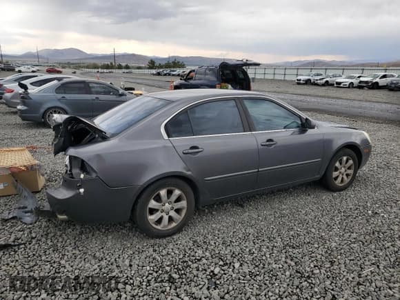 ✅ 2008 Kia Optima EX • VIN: KNAGE124185215405 • Lot: 70379555. Listed on Copart with 220,509 mi. Free auction sales archive from the USA and detailed vehicle history report at DreamBid. Image 3.