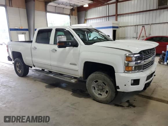 2017 Chevrolet Silverado 2500HD High Country with VIN 1GC1KXEG1HF101246, listed as a Copart auction lot 60098225 with 222,043 mi miles and Salvage title. Bid and sale history available at DreamBid. Image 4.