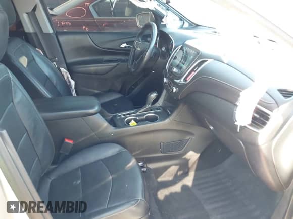 2018 Chevrolet Equinox Premier z VIN 3GNAXNEX5JS509702, wystawiony jako IAAI lot #43364923 z przebiegiem 152 731 mil mil oraz . Historia ofert i sprzedaży dostępna na DreamBid. Obrazek 5.