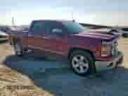 2015 Chevrolet Silverado 1500 LT with VIN 3GCPCREC7FG297544, listed as a Copart auction lot 82291355 with 133,901 mi miles and Salvage title. Bid and sale history available at DreamBid. Image 4.