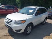 ✅ 2012 Hyundai Santa Fe GLS • VIN: 5XYZGDAG6CG117330 • Lot: 42951822. Listed on IAAI with 124,187 mi. Free auction sales archive from the USA and detailed vehicle history report at DreamBid. Image 2.