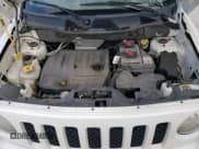 ✅ 2014 Jeep Patriot Latitude • VIN: 1C4NJPFB1ED889282 • Lot: 52318265. Listed on Copart with 122,271 mi. Free auction sales archive from the USA and detailed vehicle history report at DreamBid. Image 12.