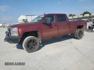 2015 Chevrolet Silverado 2500HD LTZ с VIN 1GC1KWE89FF127254, выставлен на аукционе Copart как лот 84962145 с пробегом 404 342 миль миль и Списание • Salvage title. История ставок и продаж доступна на DreamBid. Изображение 1.