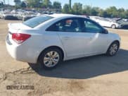 ✅ 2016 Chevrolet Cruze LS • VIN: 1G1PB5SG9G7222837 • Lot: 43190646. Listed on IAAI with 166,597 mi. Free auction sales archive from the USA and detailed vehicle history report at DreamBid. Image 4.